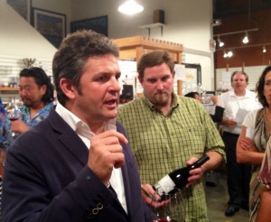 Alvaro Palacios (left) talks to a fan as one of The Wine House's partners looks on.